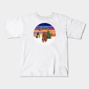 Santa Takes Off into the Sunset as his Ruby Cavalier King Charles Watches Kids T-Shirt